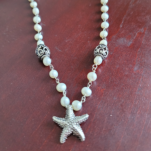 wire wrap pearl necklace with starfish pendant